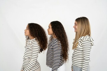 Profile portrait of nice multi racial group of girl friends look empty space toothy smile