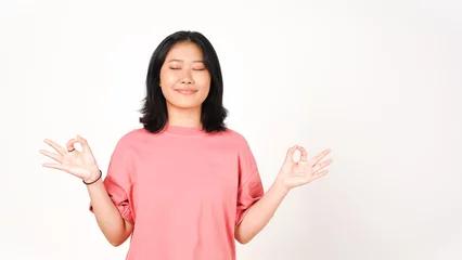 Poster Young Asian woman in pink t-shirt lotus hand position on isolated white background © Sino Images Studio