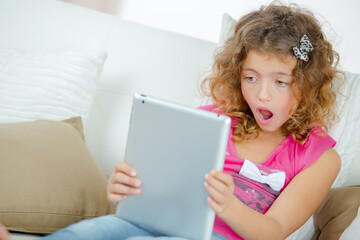Cute girl using a digital tablet