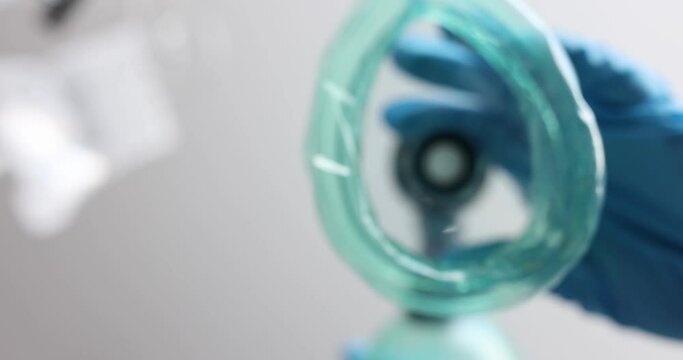 The anesthesia mask is lowered, close-up, top-down view. Anesthesiology in medical operation, hospital