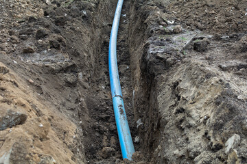 Plumbing pipe laying. Plastic polypropylene pipe. Sanitary, sewer drainage system for a multi-story...