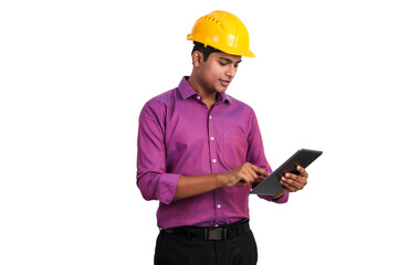 Handsome indian man wearing yellow hardhat posing with tablet in studio. 