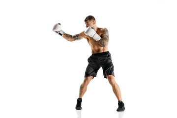 Muscular strong athletic young guy, athlete training, boxing isolated over white background. Strong hands. Concept of professional sport, combat sport, martial arts, strength