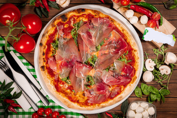 pizza with prosciutto crudo, arugula and parmesan