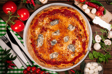 italian Gorgonzola pizza wooden background top view