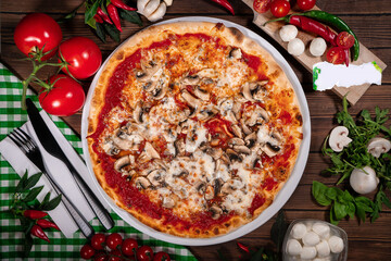 Pizza funghi with tomato sauce, mozzarella and fresh mushrooms