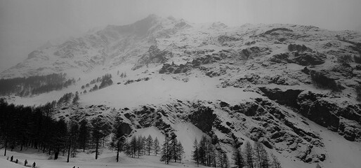 winter landscapes of the Aosta valley, the Alps mountain range in December 2023 at the beginning of the cold winter