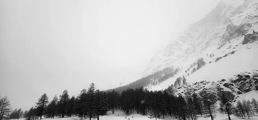 winter landscapes of the Aosta valley, the Alps mountain range in December 2023 at the beginning of the cold winter