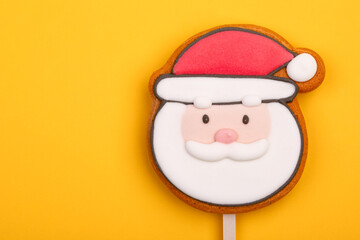 Santa Claus Gingerbread Cookie Pop on yellow background