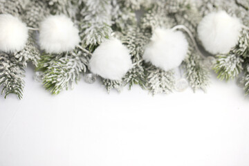 Fototapeta na wymiar Christmas background border on white. Xmas tree branches and white snow garland. New Year and Merry Christmas concept