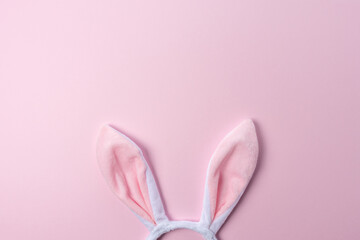 Pink bunny ears on pink background. Minimal Easter concept. - obrazy, fototapety, plakaty