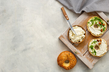 Set of fresh bread bagels with cheese cream. Healthy breakfast background - obrazy, fototapety, plakaty