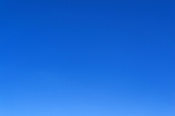 An image of a blue sky without clouds. Horizontal image. - obrazy, fototapety, plakaty