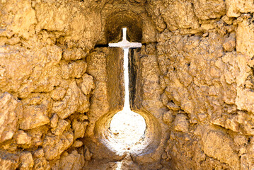 Alcala de Guadaira catle, lagoon in the shape of a cross and orb in the castle wall