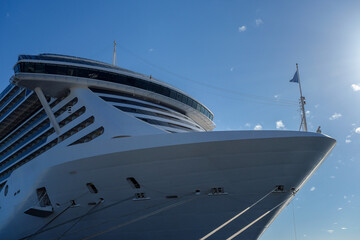 Big modern cruiseship or cruise ship liner Seaside Seaview in port with downtown Marseille skyline...