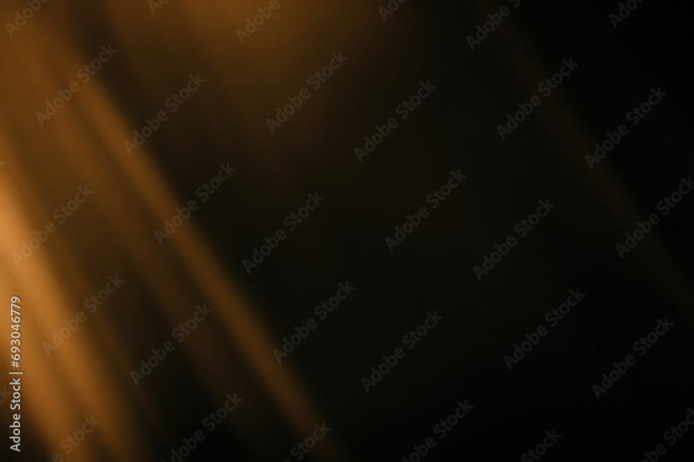 Wall mural blur colorful gold crystal light leaks on black background. defocused abstract red and orange retro 