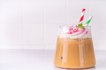 Iced Peppermint Mocha or Latte, Christmas coffee drink with crushed candy canes, whipped cream and...