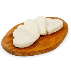 Curd cheesecake raw on a wooden board on a white background, isolated