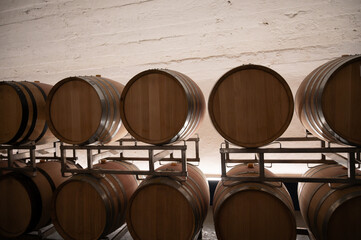 Wooden barrels. Production of cremant sparkling wine in south part of Luxembourg country on bank of Moezel, also known as Mosel, Moselle or Musel river.