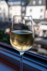 White quality riesling wine served in old restaurant in Vianden, Luxembourg