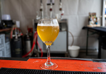 Famous fresh brewed beer served outside in Belgian beer festival in Durbuy,  special Belgian beer glass in sun lights