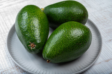 Green ripe avocado fruits from organic avocado plantation - healthy food