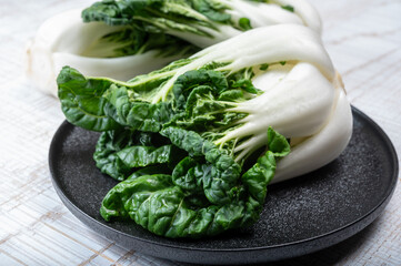 Young organic white bok choy or bak choi Chinese cabbage ready to cook - obrazy, fototapety, plakaty