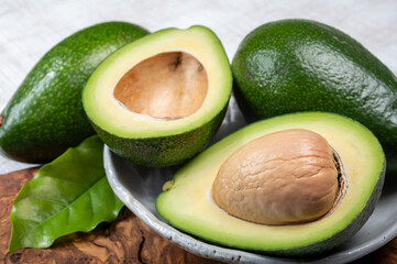 Green ripe avocado fruits from organic avocado plantation - healthy food