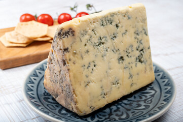 Cheese collection, English semi-soft, crumbly old stilton blue cheese close up
