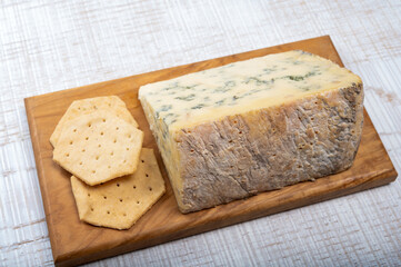 Cheese collection, English semi-soft, crumbly old stilton blue cheese close up