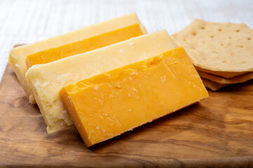 Cheese plate, British cheeses collection, Scottish coloured and English matured cheddar cheeses