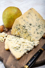 Cheese collection, English semi-soft, crumbly old stilton blue cheese close up