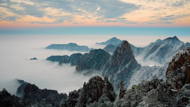 Time lapse looking out over a sea of fog at the Yellow Mountains (Huangshan) in China at sunset