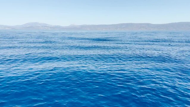 Blue Agean Sea with rolling swells, Hydra, Greece.