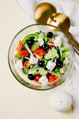 Greek salad in glass bowl.