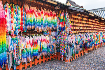 Kyoto, Japan - July 23 2023 : Thousand folded paper cranes and ema votive pictures in Azumamaro Shrine (Azumamaro Jinja) in the Fushimi Inari Taisha Shrine. - obrazy, fototapety, plakaty
