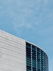 Fototapeta na wymiar Rounded lines of modern architecture building in Madrid Spain vertical photo