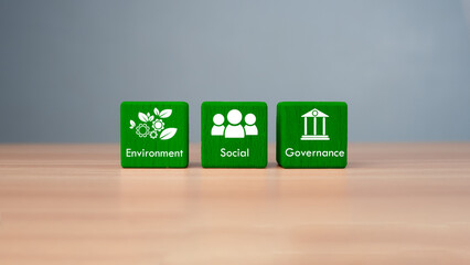 ESG concept of environmental, social and governance, wood block and icon on wooden background It is...