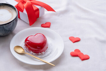 heart shaped glazed valentine cake in bed