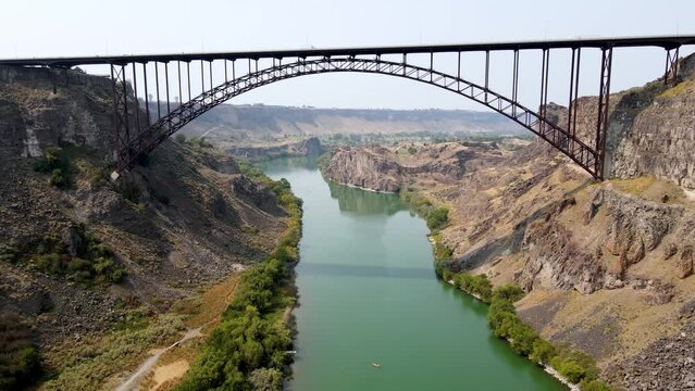 Aerial view of the Perrine Memorial Bridge over the snake river in Twin Falls, Idaho. With cars driving across the bridge.