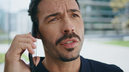 Hispanic director talking phone call at street closeup. Stressed man disputing