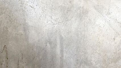 Dark-coloured cement walls with a polished attic pattern.