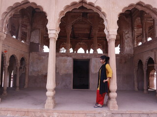 Woman travelling in heritage place named jawahar Burj in lohagarh fort of bharatpur rajasthan a tourist places of India, selective focus 