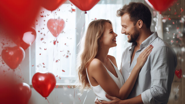 Couple is closely embracing and smiling at each other amidst a festive background