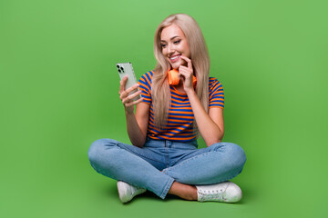 Full length photo of youngster woman wear t shirt browsing phone testing quality her wireless...