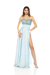 Full length of gorgeous elegant sensual brunette woman wearing fashion blue evening dress isolated on white background