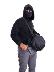 An unidentified male criminal wearing a black hoodie and covering his face, holding a handgun and...