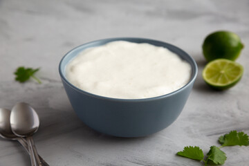 Homemade Mexican Crema Sauce in a Bowl, side view.