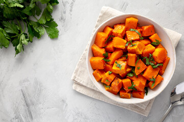 Home-baked Butternut Squash with Herbs and Spices, top view. Space for text. - obrazy, fototapety, plakaty
