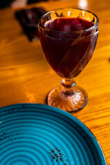 a glass of wine and a plate